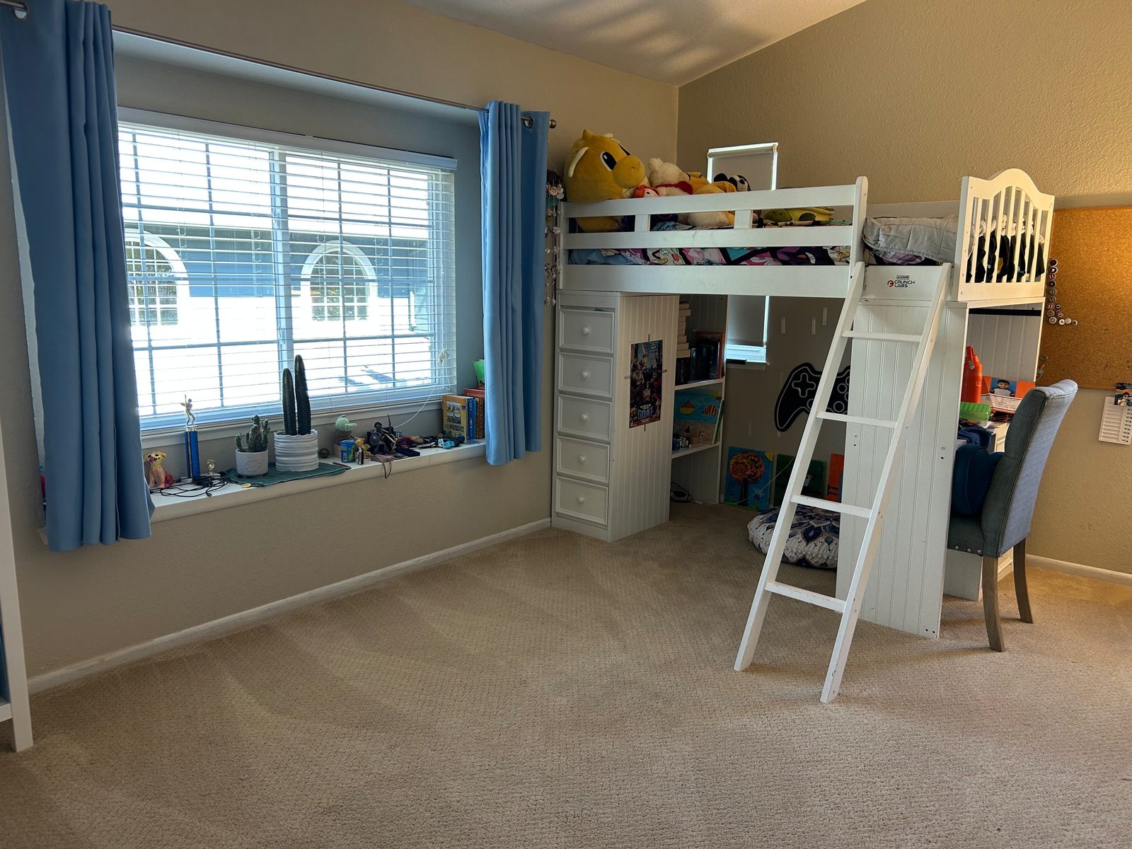 Kids' bedroom after — floor completely clear, loft bed and desk tidy