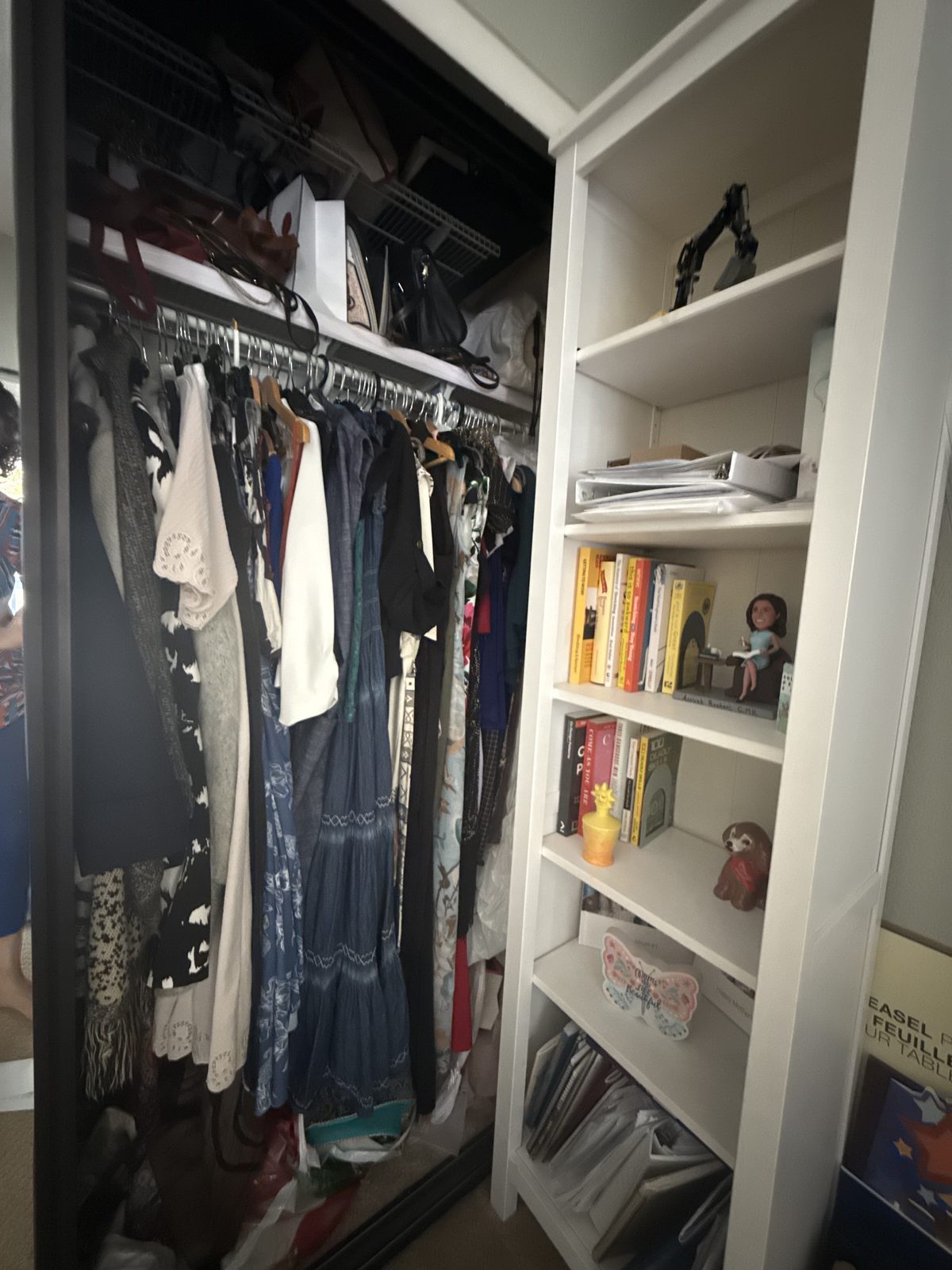Closet before — crowded rod and items stacked on the top shelf
